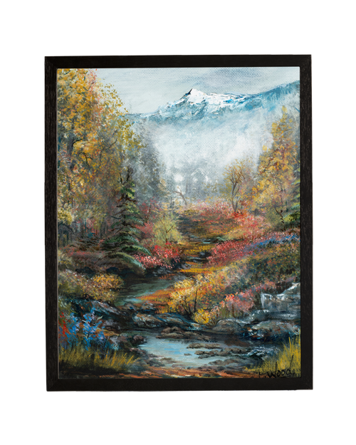 Framed fine art reproduction of Path of Many Colors, featuring a colorful woodland stream winding through vibrant autumn foliage with snow-capped mountains in the distance, painted by Laura Fay Wood Cavaliere.